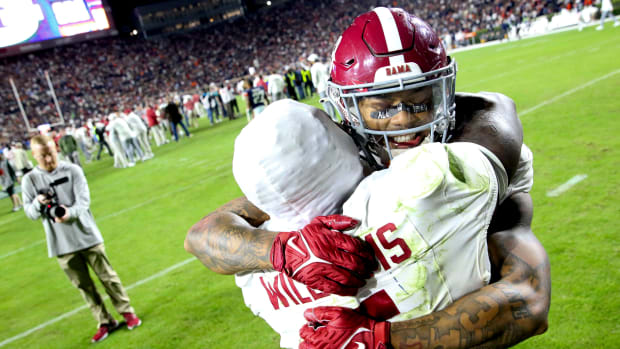 Nov 25, 2023; Auburn, Alabama, USA; Alabama Crimson Tide defensive back Malachi Moore (13) and running back Roydell Williams (5) celebrate after a last-second victory against the Auburn Tigers at Jordan-Hare Stadium. Alabama won 27-24.